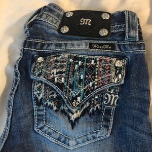 Bootcut jeans with Aztec/tribal pattern on pockets